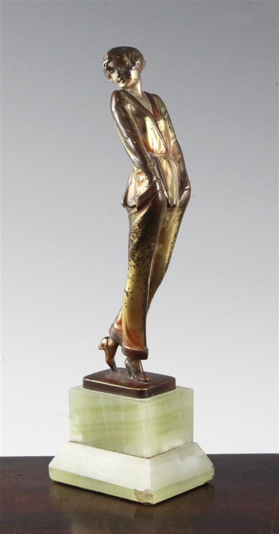 A Lorenzl patinated bronze figure of a young lady wearing a pyjama suit, 9in.